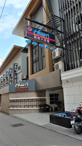 Honey 1 Body Massage: building with the venue signs