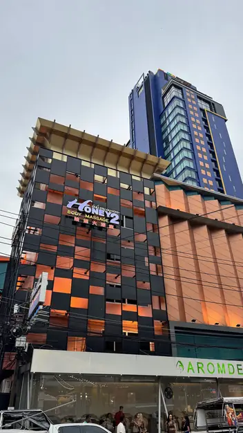 Honey Body Massage 2: building with the venue sign
