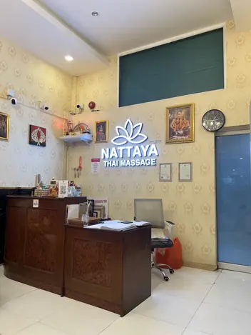 Nattaya Massage: reception with the lit logo