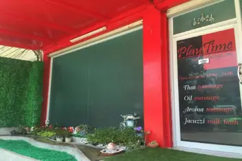PlayTime Massage: play Time Massage shopfront with red awning and service list
