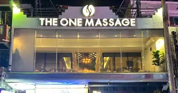 The One Massage Pattaya: night view of The One Massage shopfront with illuminated sign